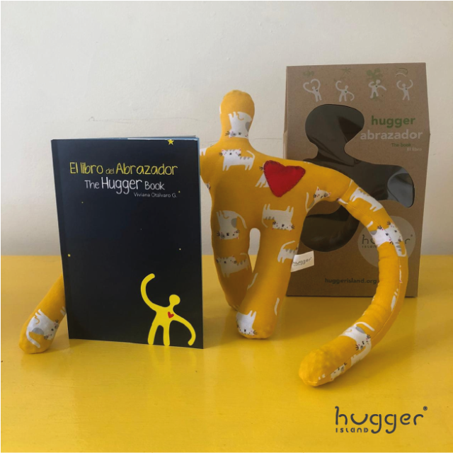 LIBRO "LA ISLA DE LOS ABRAZADORES" + ABRAZADOR (AMARILLO CON GATOS) by Hugger Island